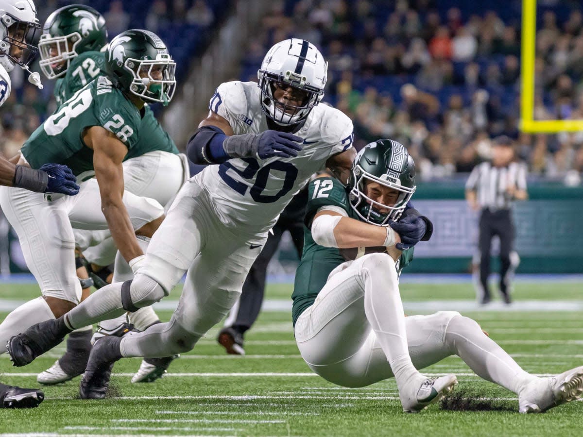 Nov 24, 2023; Detroit, Michigan, USA; Penn State Nittany Lions defensive end Adisa Isaac (20) pressures and sacks Michigan State Spartans quarterback Katin Houser (12) during the second half at Ford Field. Mandatory Credit: David Reginek-USA TODAY Sports  